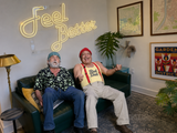 Cheech and Chong at Rad Dad Alternative Wellness under Feel Better neon sign