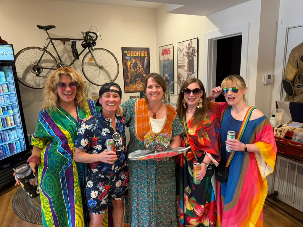 Five customers together in the store, drinks in hand